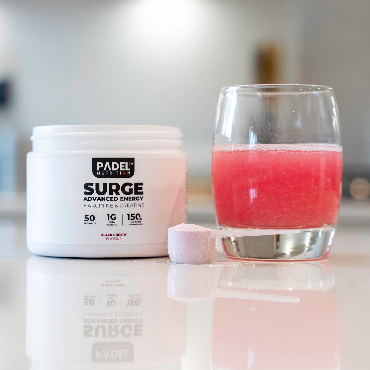 adel Nutrition SURGE Advanced Energy pre padel supplement on kitchen worktop