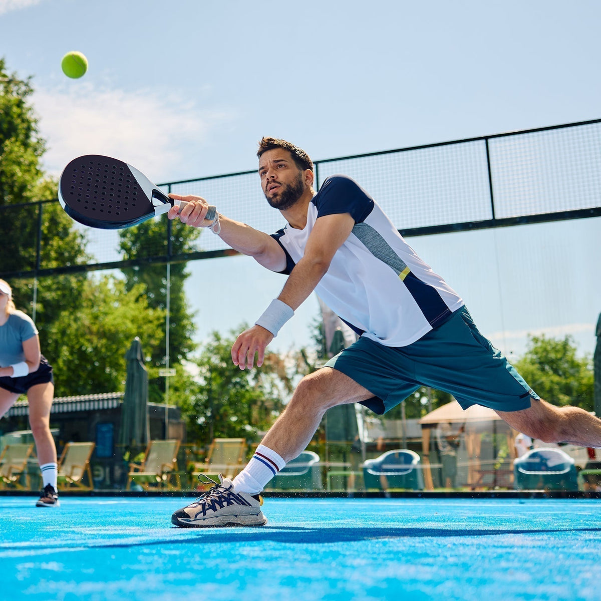 Padel player stretching sore knee after a match, highlighting joint pain and recovery support with MOVE-PRO Joint Formula supplement